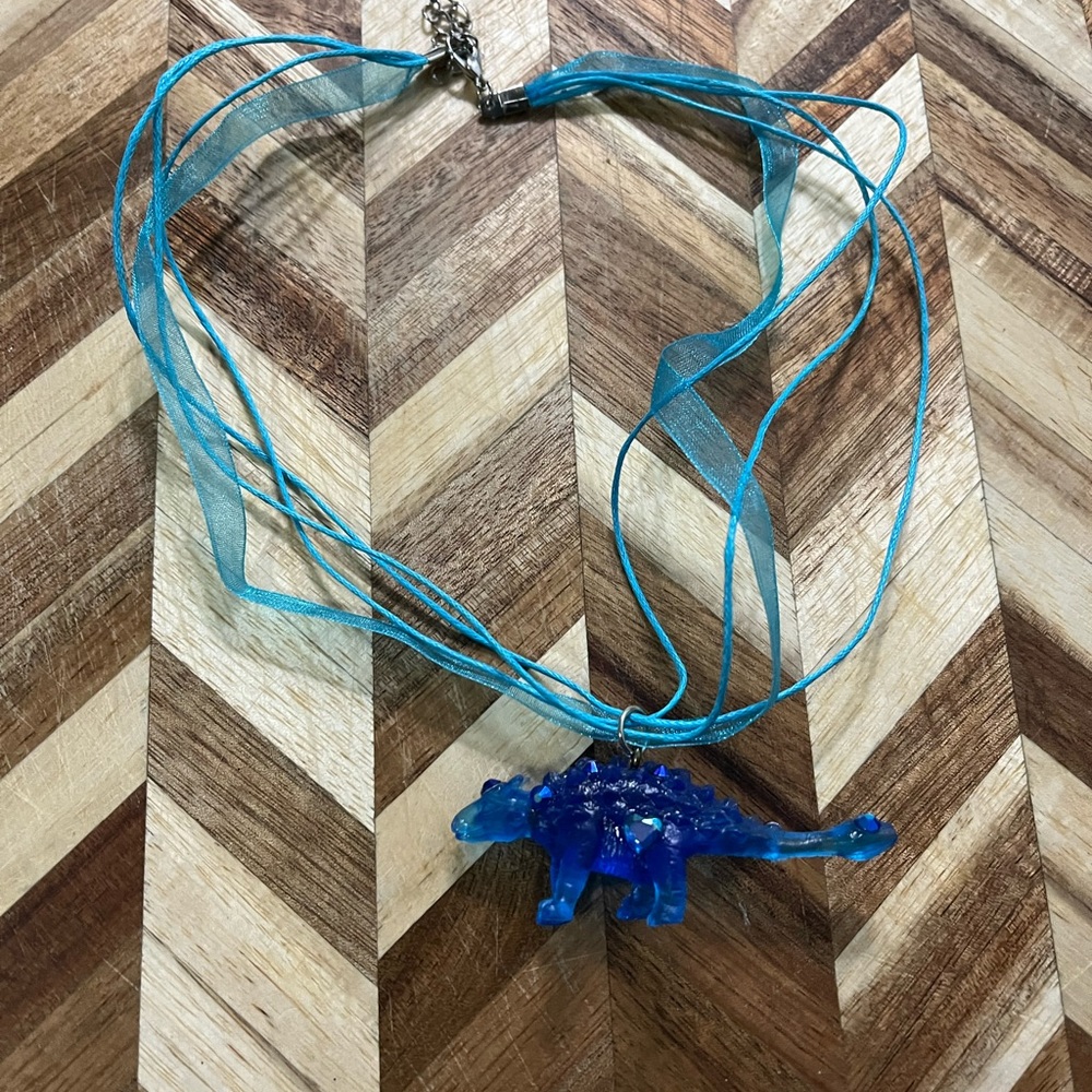 Blue Crystal embellished Dinosaur Necklace on organza ribbon cord